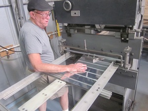 An arbor press  set up to make the a small bend required in the fabrication of a Cessna lower aileron skin