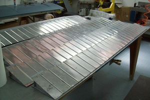 An arbor press  set up to make the a small bend required in the fabrication of a Cessna lower aileron skin